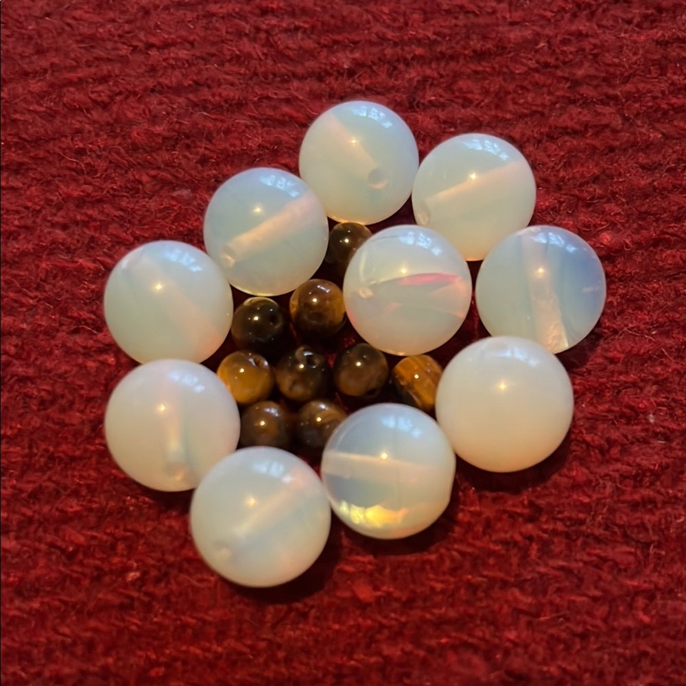 8 Opalite and 10 Tiger Eye Beads every purchase comes w/a semi precious stone.